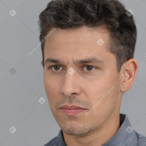 Neutral white adult male with short  brown hair and brown eyes