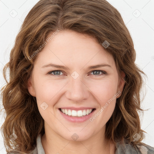 Joyful white young-adult female with long  brown hair and green eyes