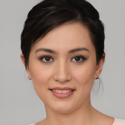 Joyful white young-adult female with medium  brown hair and brown eyes