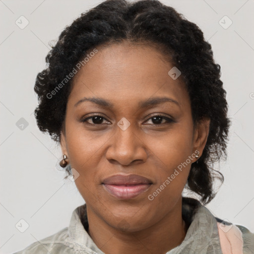 Joyful black adult female with short  brown hair and brown eyes