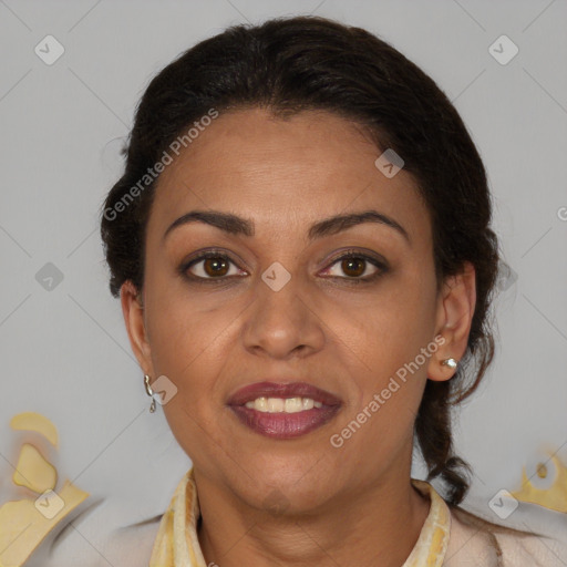 Joyful latino adult female with medium  brown hair and brown eyes