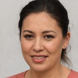 Joyful white young-adult female with medium  brown hair and brown eyes