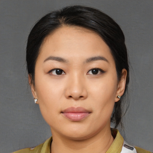 Neutral asian young-adult female with medium  black hair and brown eyes