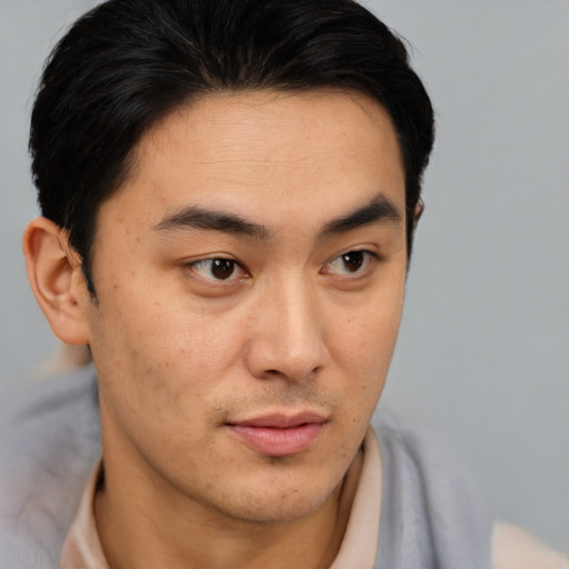 Neutral asian young-adult male with short  brown hair and brown eyes