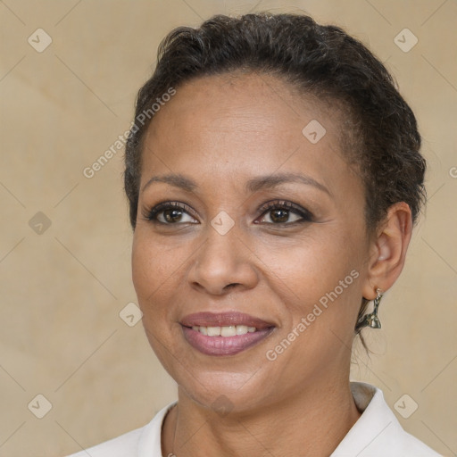 Joyful black adult female with short  brown hair and brown eyes