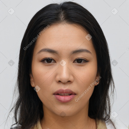 Joyful asian young-adult female with long  brown hair and brown eyes