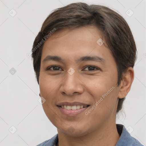 Joyful latino young-adult male with short  brown hair and brown eyes