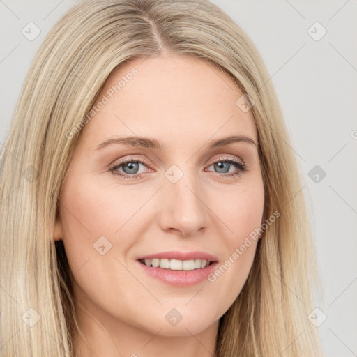 Joyful white young-adult female with long  brown hair and blue eyes