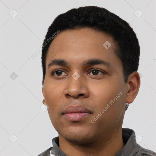 Neutral latino young-adult male with short  black hair and brown eyes