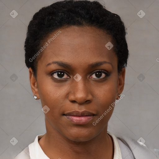 Joyful black young-adult female with short  black hair and brown eyes