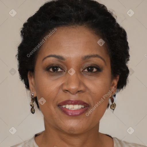 Joyful black adult female with medium  brown hair and brown eyes