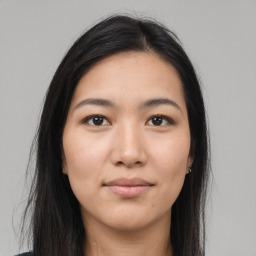 Joyful asian young-adult female with long  brown hair and brown eyes