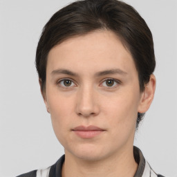 Neutral white young-adult female with short  brown hair and brown eyes