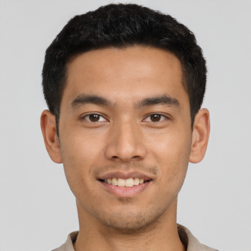 Joyful asian young-adult male with short  black hair and brown eyes