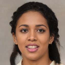 Joyful latino young-adult female with long  brown hair and brown eyes