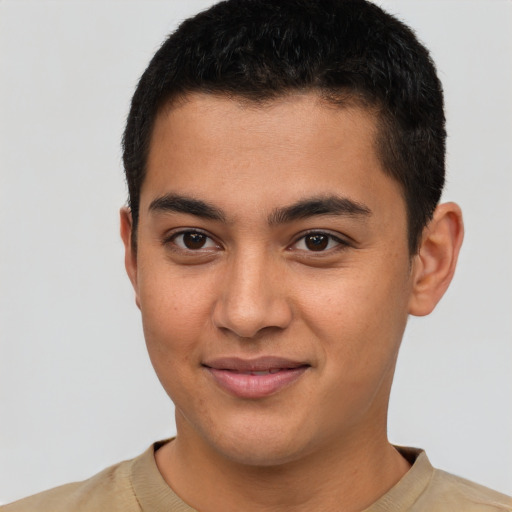 Joyful latino young-adult male with short  brown hair and brown eyes