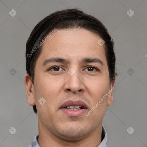 Joyful white adult male with short  brown hair and brown eyes