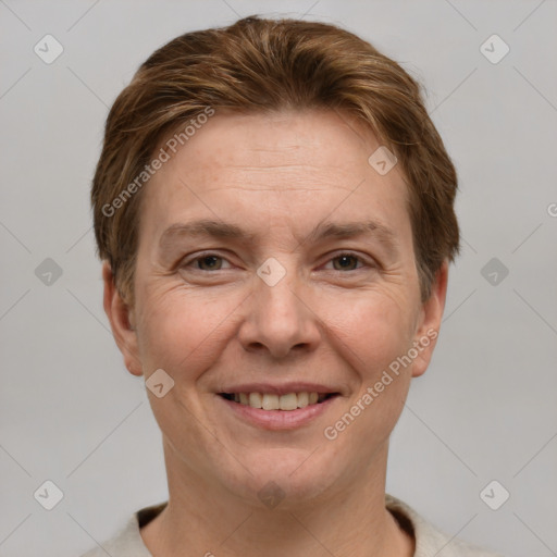 Joyful white adult female with short  brown hair and grey eyes