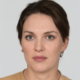 Neutral white young-adult female with short  brown hair and grey eyes