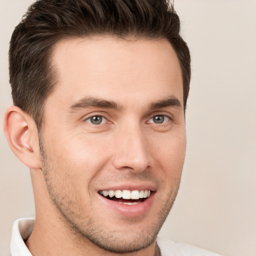 Joyful white young-adult male with short  brown hair and brown eyes