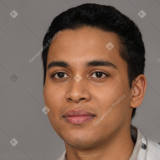 Joyful latino young-adult male with short  black hair and brown eyes