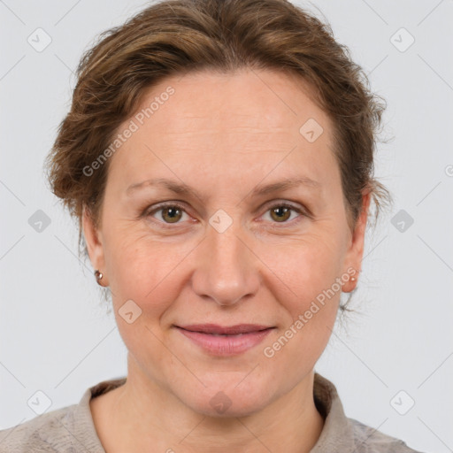 Joyful white adult female with short  brown hair and brown eyes