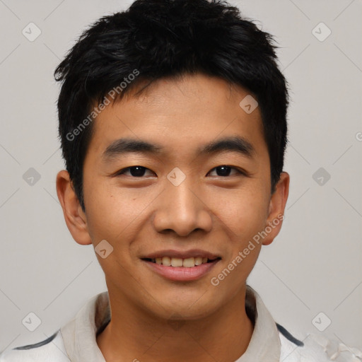 Joyful asian young-adult male with short  black hair and brown eyes