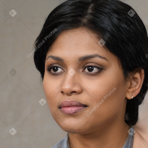 Joyful black young-adult female with medium  black hair and brown eyes