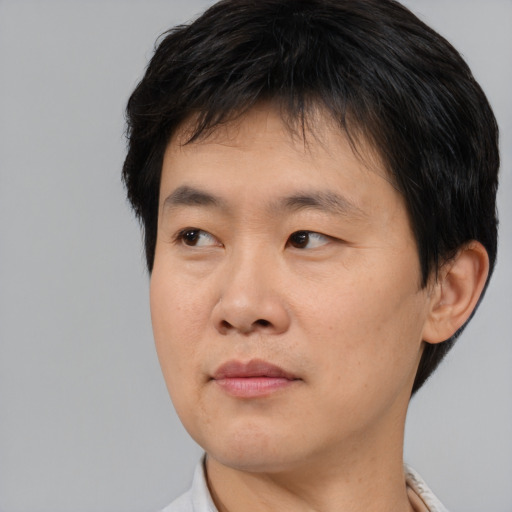 Neutral asian young-adult male with short  black hair and brown eyes