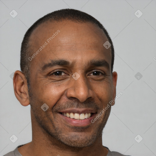 Joyful black adult male with short  brown hair and brown eyes