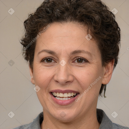 Joyful white adult female with short  brown hair and brown eyes