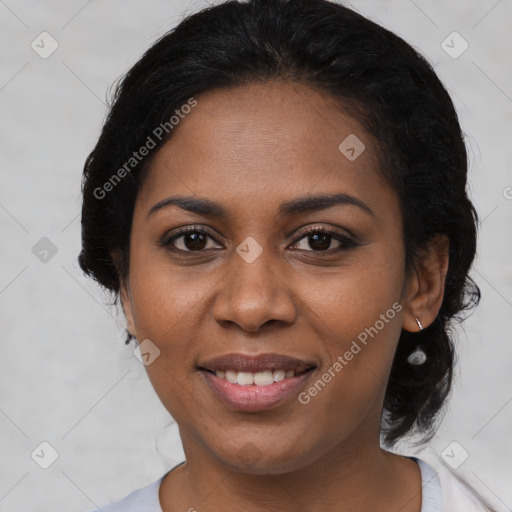 Joyful black young-adult female with medium  black hair and brown eyes