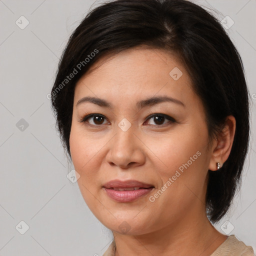 Joyful latino young-adult female with medium  brown hair and brown eyes