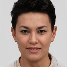 Joyful latino young-adult female with short  black hair and brown eyes