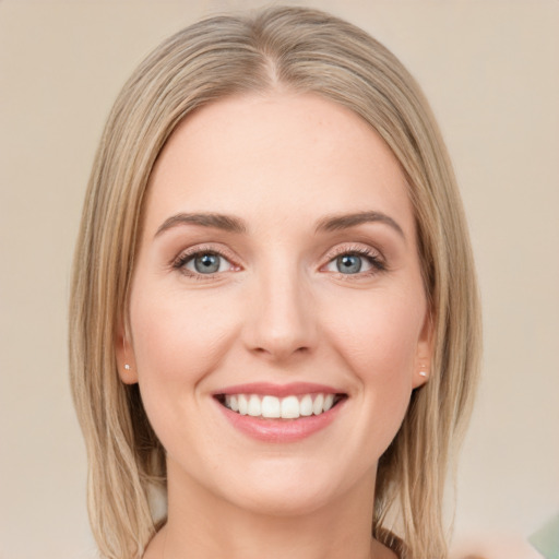 Joyful white young-adult female with long  brown hair and green eyes