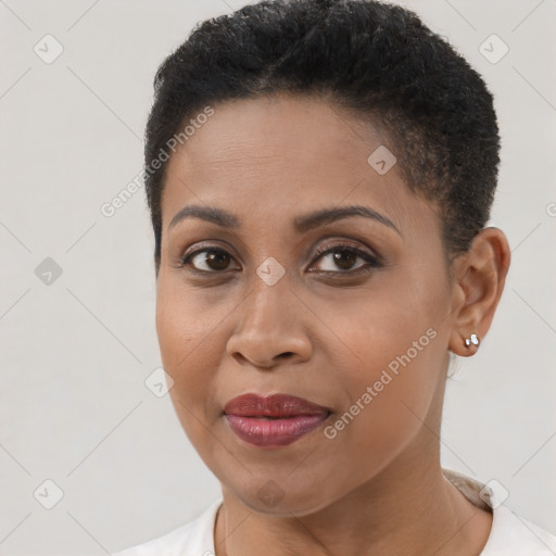 Joyful black young-adult female with short  brown hair and brown eyes