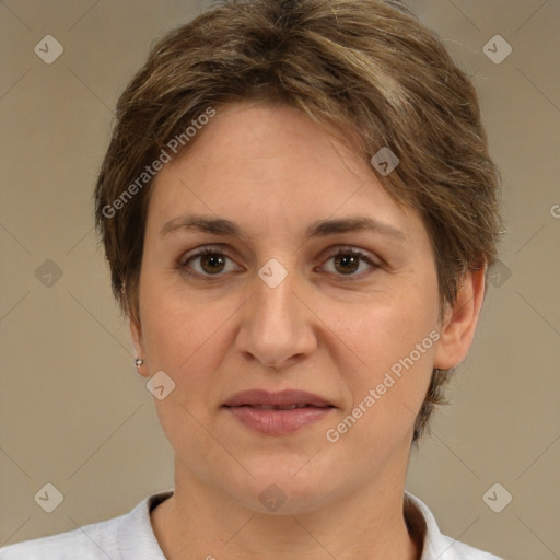 Joyful white adult female with short  brown hair and brown eyes