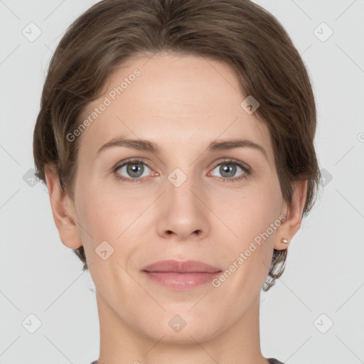 Joyful white young-adult female with short  brown hair and grey eyes