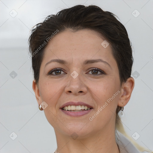 Joyful white adult female with short  brown hair and brown eyes