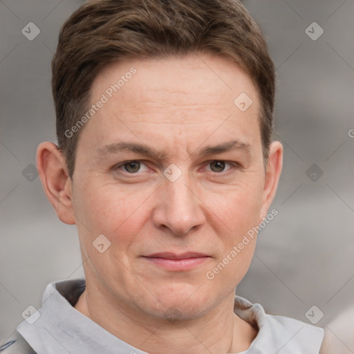 Joyful white adult male with short  brown hair and grey eyes