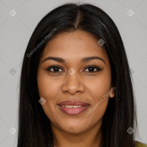 Joyful black young-adult female with long  brown hair and brown eyes