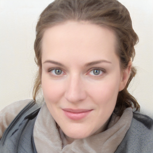 Joyful white young-adult female with medium  brown hair and blue eyes