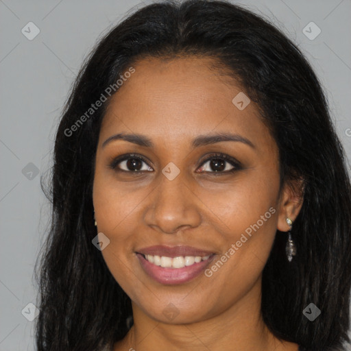 Joyful black young-adult female with long  brown hair and brown eyes