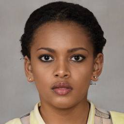 Neutral black young-adult female with short  brown hair and brown eyes