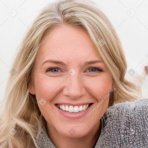 Joyful white young-adult female with long  brown hair and blue eyes