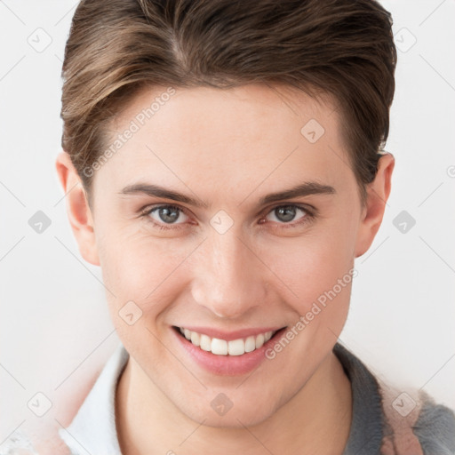 Joyful white young-adult female with short  brown hair and grey eyes