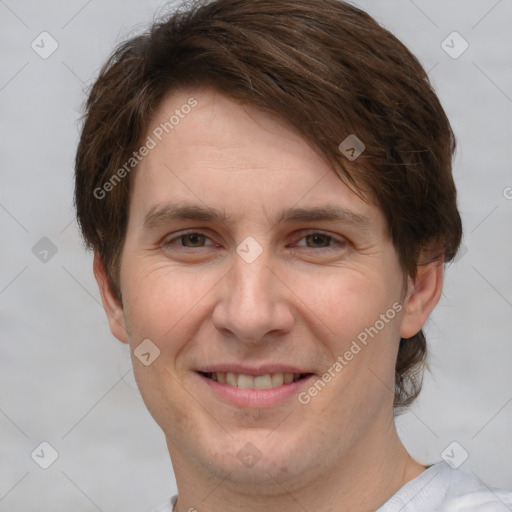 Joyful white adult male with short  brown hair and brown eyes