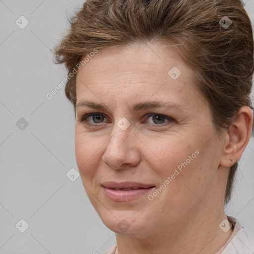 Joyful white adult female with short  brown hair and brown eyes