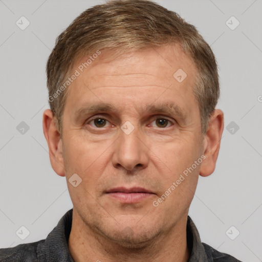 Joyful white adult male with short  brown hair and grey eyes