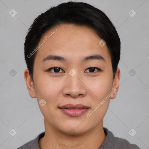 Joyful asian young-adult female with short  black hair and brown eyes